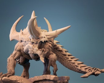 May include: A detailed miniature of a fearsome, reptilian creature with horns and spikes. The creature is posed in a menacing stance, with its mouth open in a roar. The miniature is painted in a light brown color and is set on a rocky base.