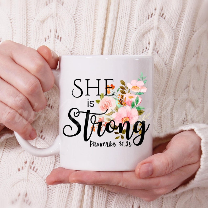 May include: White ceramic mug with a floral design and the text "She is Strong Proverbs 31:25"