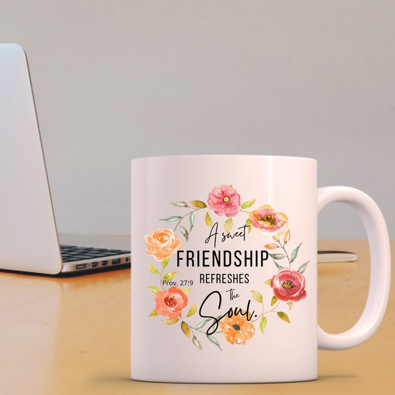May include: White ceramic coffee mug with a floral design and the text "A sweet FRIENDSHIP REFRESHES the Soul. Prov. 27:9"