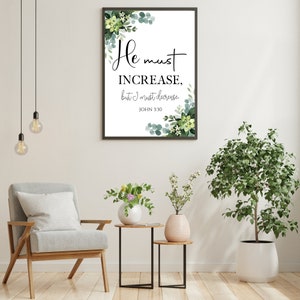 Peut inclure: Une impression encadr&eacute;e avec un fond blanc et des accents floraux verts. L'impression pr&eacute;sente le texte "Il faut qu'il croisse, mais moi il faut que je diminue. Jean 3:30".