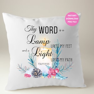 May include: White cushion with a watercolour illustration of a lit candle, pine branches, berries, and the text "Thy WORD is a Lamp unto my feet and a Light unto my path" with the scripture reference "PSALM 119:105".