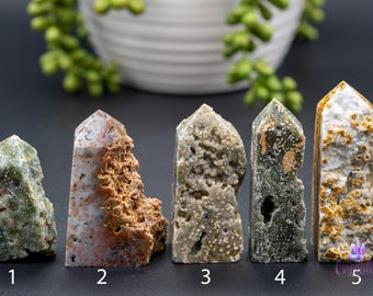 May include: Five agate crystal points with different colors and patterns. The points are numbered 1 through 5.