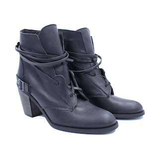 Handmade lace up cowboy ankle women boots. It is  black leather western boot with wooden stable heel, rubber on the sole and soft insole for extra comfort. This is a nice choice for every outfit.
