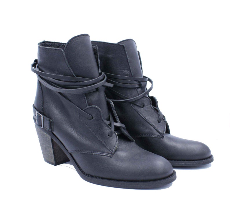 Handmade lace up cowboy ankle women boots. It is  black leather western boot with wooden stable heel, rubber on the sole and soft insole for extra comfort. This is a nice choice for every outfit.