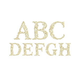 May include: Gold-coloured, ornate letters A, B, C, D, E, F, G, and H. Each letter features a detailed, swirling design. The letters are arranged in two rows on a white background, ideal for decorative projects.