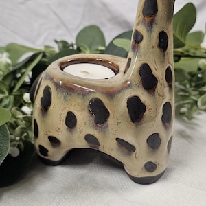 May include: A white ceramic mug with a black handle and the text "But First, Coffee" in a black, bold font. The mug is likely 12-16 ounces, perfect for a morning beverage.