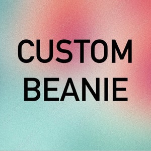 May include: A graphic with the words "CUSTOM BEANIE" in bold black text. The background is a gradient of pink, teal, and white. The image is designed to promote custom beanies.