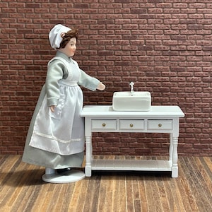 Beautiful little vintage style bathroom cabinet with sink and faucet. White lacquered finish, turned legs and 3 functional drawers. 12307