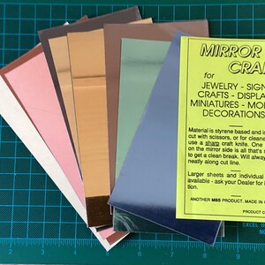 May include: Assortment of coloured mirror craft sheets. The sheets are styrene based and can be cut with scissors or a craft knife. The packaging includes instructions for use and information about the product. The product code is MGT-A.