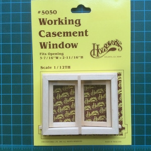 May include: A wooden miniature working casement window, #5050, for dollhouses. It is 3-7/16 inches wide by 2-11/16 inches high and fits a 1/12th scale dollhouse.