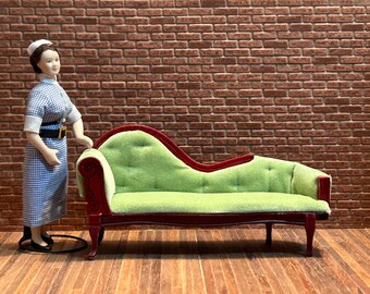 Sofa chair in mahogany wood and apple green velvet upholstery. Curved legs and backrest. 1:12 scale for dollhouses. 21803.