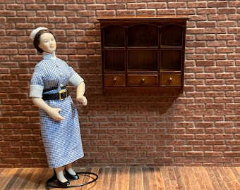 Wooden wall shelf, featuring 6 compartments and 3 functional drawers, with fretwork at the top and bottom. 1:12 scale for dollhouses. 21300