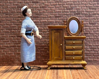 Asymmetrical wardrobe chest with oval mirror on turned columns. Antique-style miniature 1:12 scale for dollhouses. 20804.