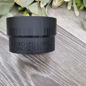 May include: A black metal socket wrench with the text "CHROME VANADIUM 10mm" printed on the side.