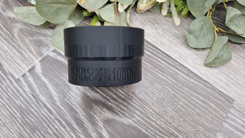 May include: A black metal socket wrench with the text "CHROME VANADIUM 10mm" printed on the side.
