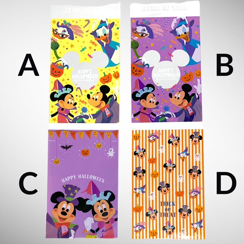May include: Four different Halloween-themed plastic bags with Mickey Mouse and Minnie Mouse characters. The bags are purple, orange, and yellow with various Halloween designs. The text on the bags reads "Happy Halloween" and "Trick or Treat".