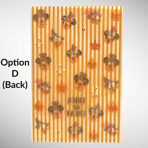 May include: Orange and white striped background with various Halloween themed stickers. The stickers feature Mickey Mouse and other Disney characters dressed in Halloween costumes. The text "Trick or Treat" is printed on the background.