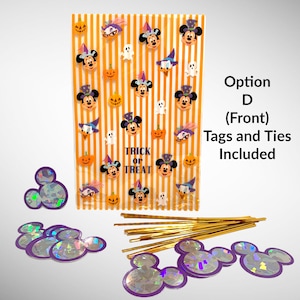 May include: Orange and white striped treat bags with Mickey Mouse Halloween stickers. The bags have the text "Trick or Treat" and come with tags and ties. The tags are iridescent purple Mickey Mouse heads.