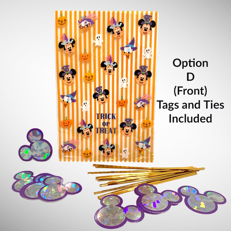 May include: Orange and white striped treat bags with Mickey Mouse Halloween stickers. The bags have the text "Trick or Treat" and come with tags and ties. The tags are iridescent purple Mickey Mouse heads.