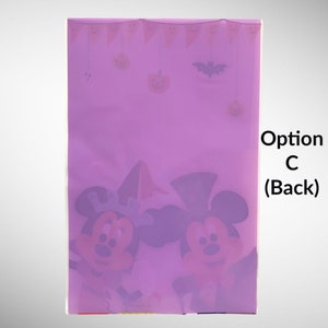 May include: Purple plastic bag with a Halloween theme. The bag features Mickey Mouse and Minnie Mouse dressed in Halloween costumes. The bag has a banner with pumpkins and bats. The text on the bag reads "Option C (Back)".