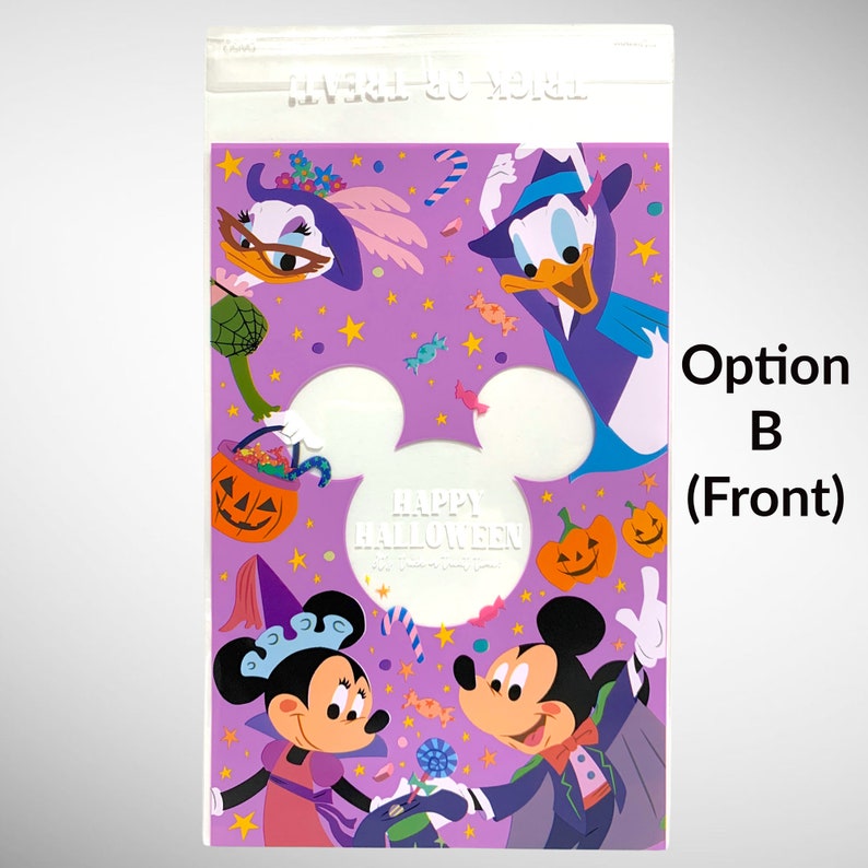 May include: A purple plastic bag with a clear front panel. The bag features a Halloween-themed design with Mickey Mouse, Minnie Mouse, and Donald Duck dressed in costumes. The text "Happy Halloween" is printed in white on a white Mickey Mouse head silhouette.