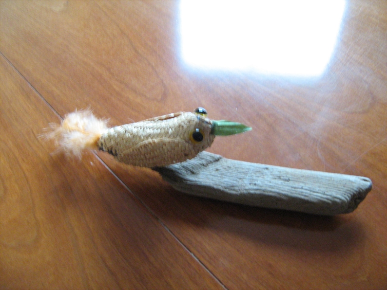 Treecreeper Bird on driftwood woven straw