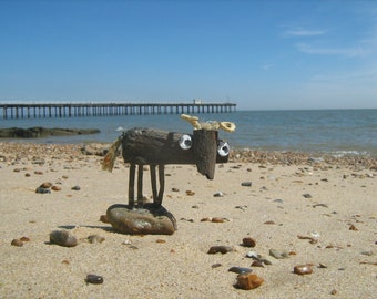 BOSUN -driftwood cow -with sea pebble/metal and twines from beach