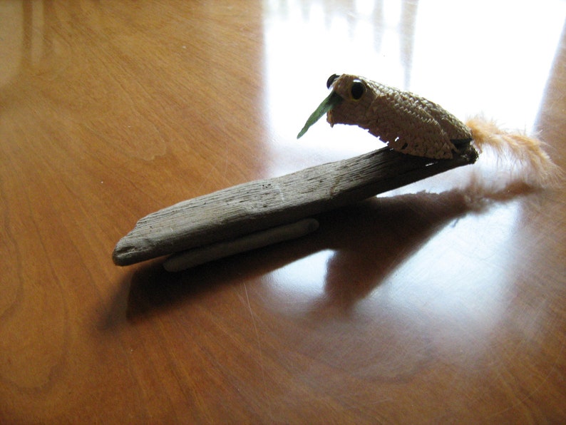 Treecreeper Bird on driftwood woven straw