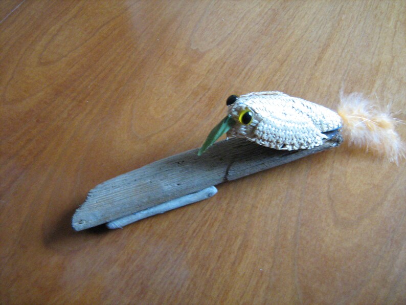 Treecreeper Bird on driftwood woven straw