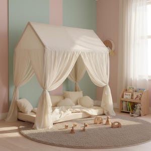 Muslin fabric canopy over reading pillows