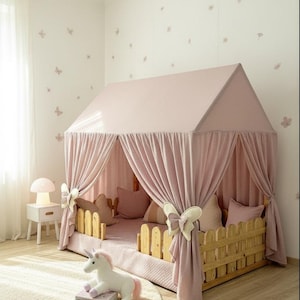 Muslin fabric canopy over reading pillows