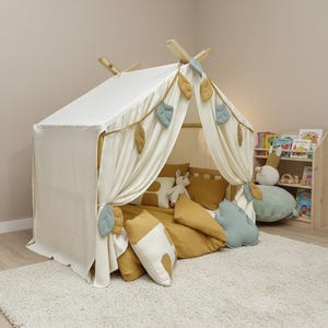 Kids room canopy with leaf ties and soft breathable cotton fabric.