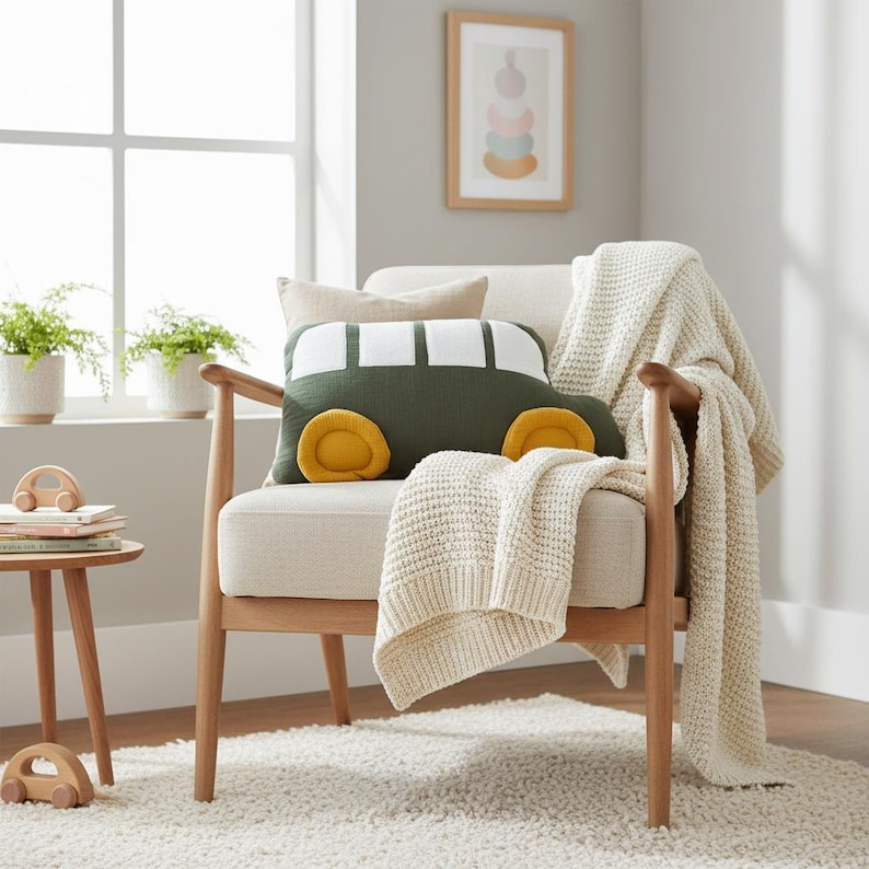 White car pillow with mustard yellow and olive green accents for kid’s bedroom