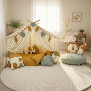 Muslin bed canopy for toddler and kids’ bedroom styled with pillows and décor.