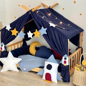 May include: A white ceramic mug with a black handle and the text "But First, Coffee" in a black, handwritten-style font. The mug is on a white surface.