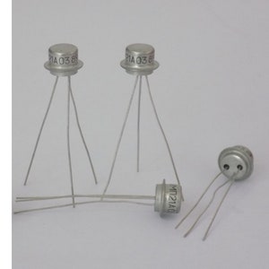 May include: Three silver transistors with three leads each. The transistors are labelled with the text "21A038" and "MP121A".