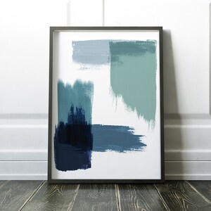 May include: Abstract art print in a black frame with blue and green brushstrokes on a white background.