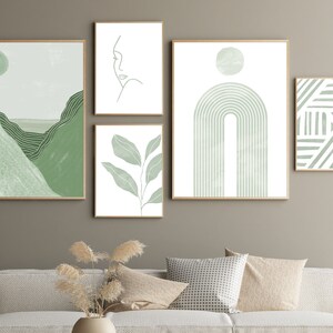 Gallery wall art set of 5 digital prints in sage green. The designs include a stripes print, a mid century modern rainbow, an abstract landscape, a leaves print and a line drawing of a woman's face.