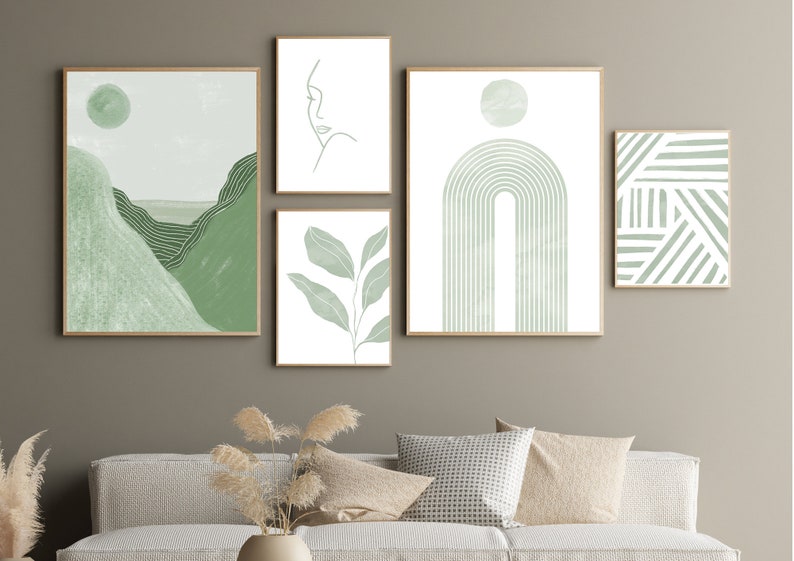 Gallery wall art set of 5 digital prints in sage green. The designs include a stripes print, a mid century modern rainbow, an abstract landscape, a leaves print and a line drawing of a woman's face.
