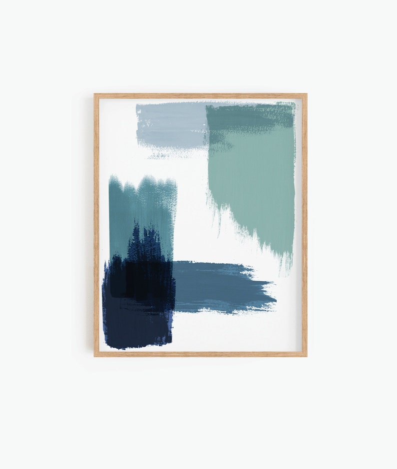 May include: Abstract art print with a wooden frame. The print features a blue, green, and white color scheme with brushstrokes.