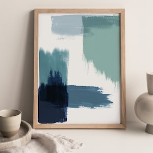 May include: Abstract art print in a wooden frame with blue, green, and white brushstrokes.
