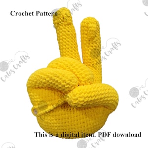 Pu&ograve; includere: Schema a uncinetto per una mano gialla a forma di segno di pace. Lo schema &egrave; un download digitale.