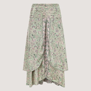 May include: A green and pink paisley print midi skirt with a high waist and a ruffled hem.