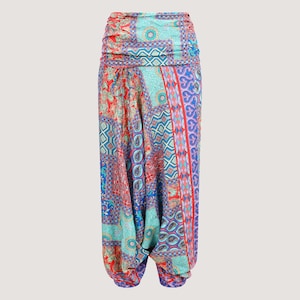 May include: Colourful printed trousers with a wide waistband and a loose, flowing fit. The trousers feature a patchwork design with geometric and floral patterns in shades of blue, red, and green.