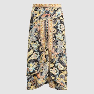 May include: A black midi skirt with a paisley print in shades of gold, blue, and red. The skirt has a layered design and a high waist.