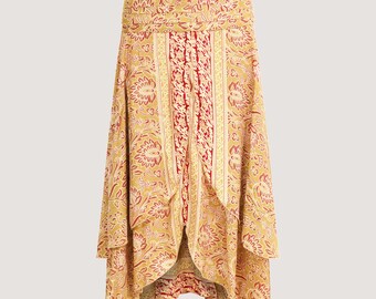 May include: A flowing, wrap-style skirt with a vibrant floral pattern in shades of yellow, red, and cream. The skirt features a layered design with a central panel of red and cream vertical stripes. The fabric appears lightweight and suitable for warm weather.