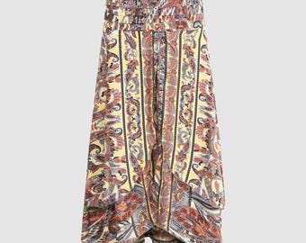 May include: A yellow, red, and blue paisley patterned skirt with a ruffled hem.