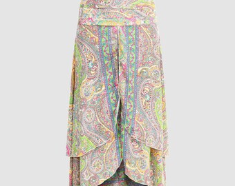 May include: A multi-layered skirt with a paisley print in shades of pink, green, blue, and yellow. The skirt has a high waist and a flowing silhouette.