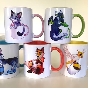 May include: Six white ceramic mugs with colorful interiors and handles. Each mug features a cartoon animal design: a cat, dragon, fox, husky, and a bird. The mugs are stacked, showcasing the variety of designs and colors.