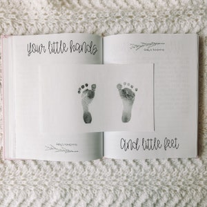 Two page spread for baby handprints and footprints.